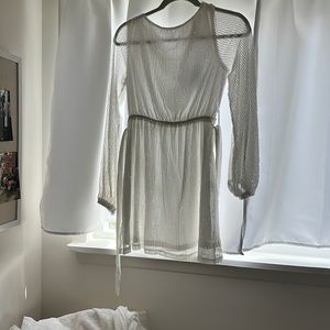 White sequin mini dress with long sleeves and belt